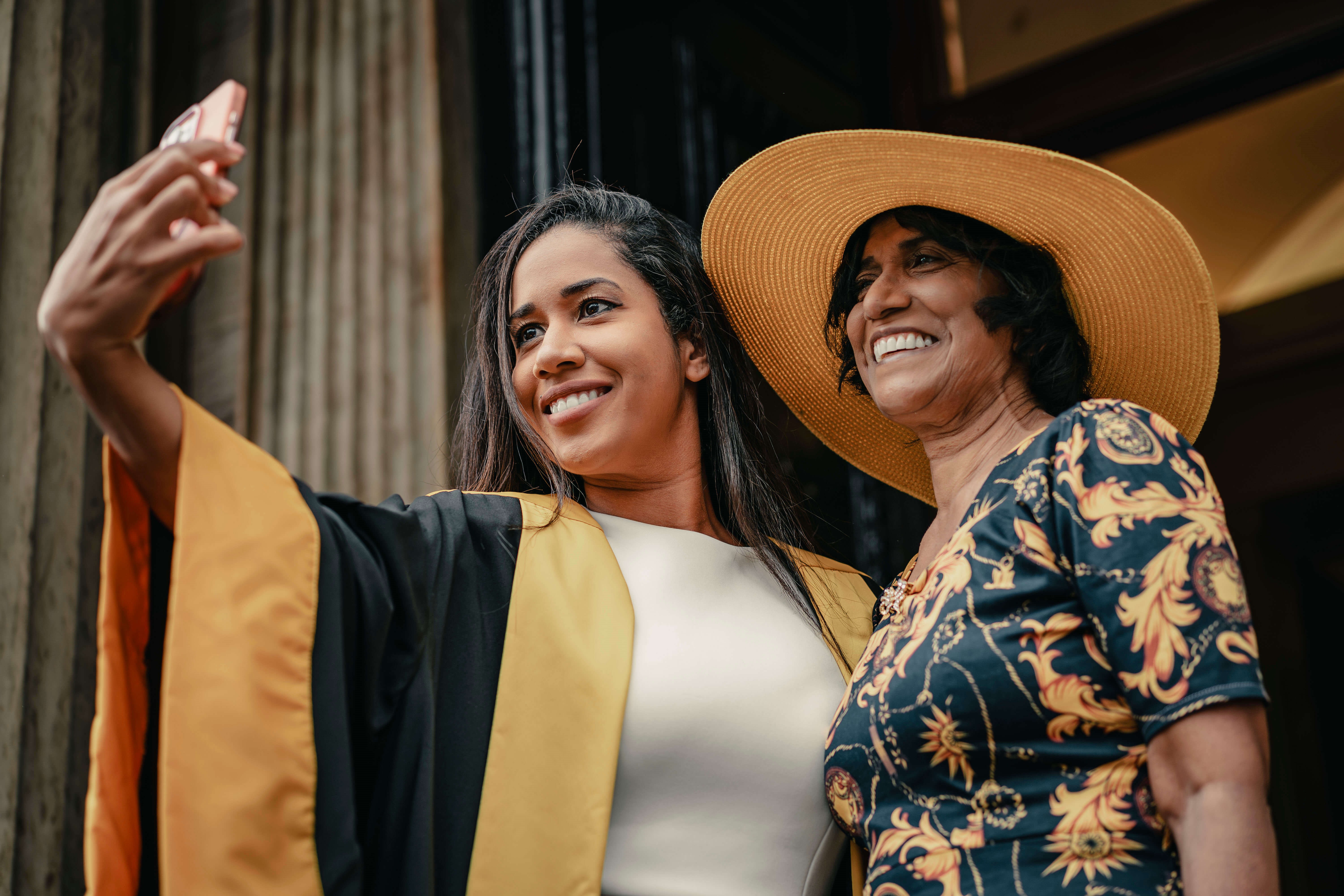 Delegate celebrates with family at a diploma ceremony