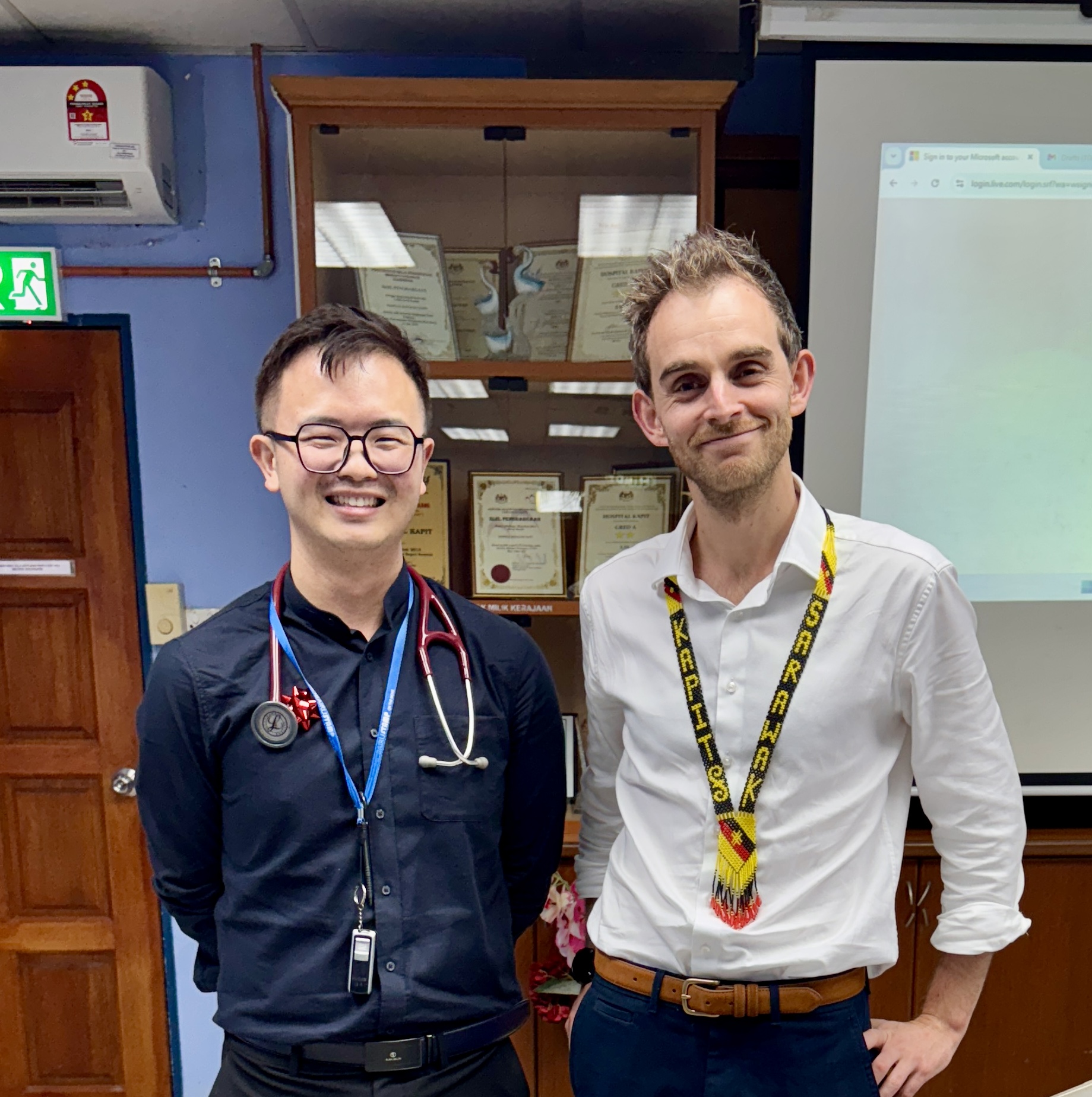 Dr Harrison Stubbs standing with Dr Chai 