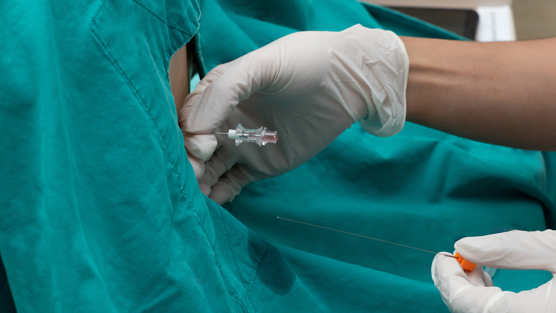 Lumber puncture in patient's back 